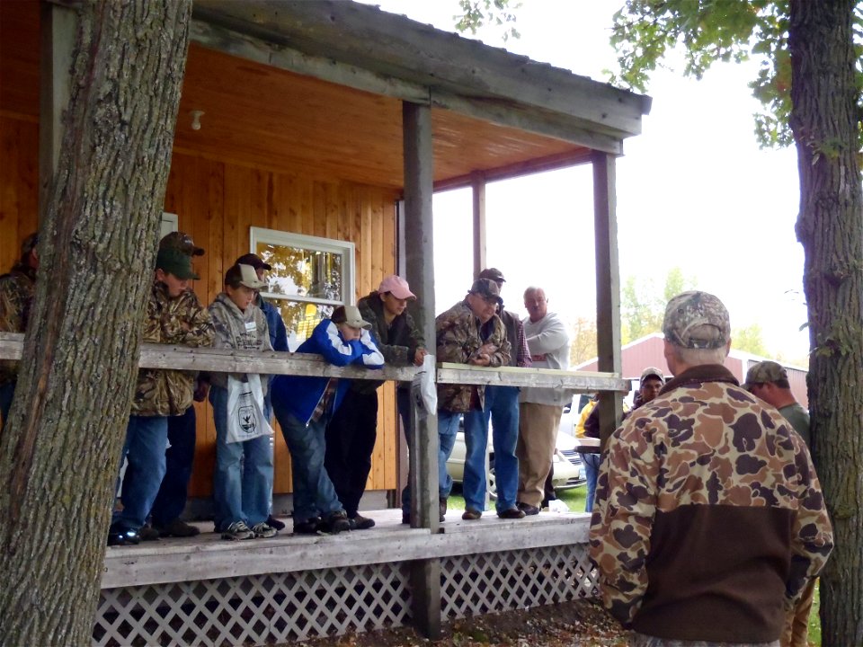 youth listening to a demonstration by North American Goose Calling Champion, Cory Loeffler