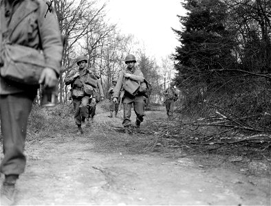 SC 374835 - 1st Infantry Division men patrol area near Mittelscheid, Germany. 26 March, 1945. photo