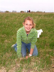 Girl Scout planting tree