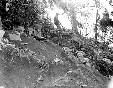 SC 364611 - Soldiers from Co. A, 145th Inf., 37th Div., in position on a hillside where they had the Japs surrounded.