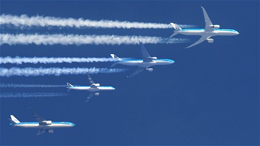 A collection of  four different KLM planes from Amsterdam: