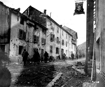 SC 196160 - French troops of 3rd Inf. Div., 7th Army, Alg., move through first town liberated in new French drive. photo