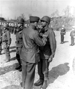 SC 364063 - Secretary of the Army Frank Pace Jr. (left) awards the Silver Star to M/Sgt. Edgar Carter, Palestine, Texas, A Btry. 96th FABn., X Corps, at a ceremony in the X Corps sector, Korea.