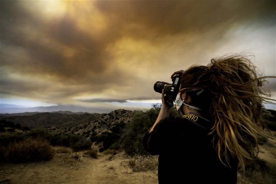 A photographer capturing smoke from the Apple Fire