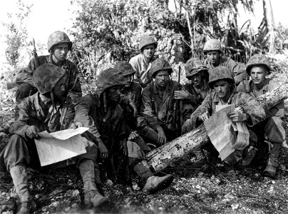 Planning the attack: Here, the Marine commanding officer of a unit about to attack goes over the plans with his platoon leaders and squad leaders.