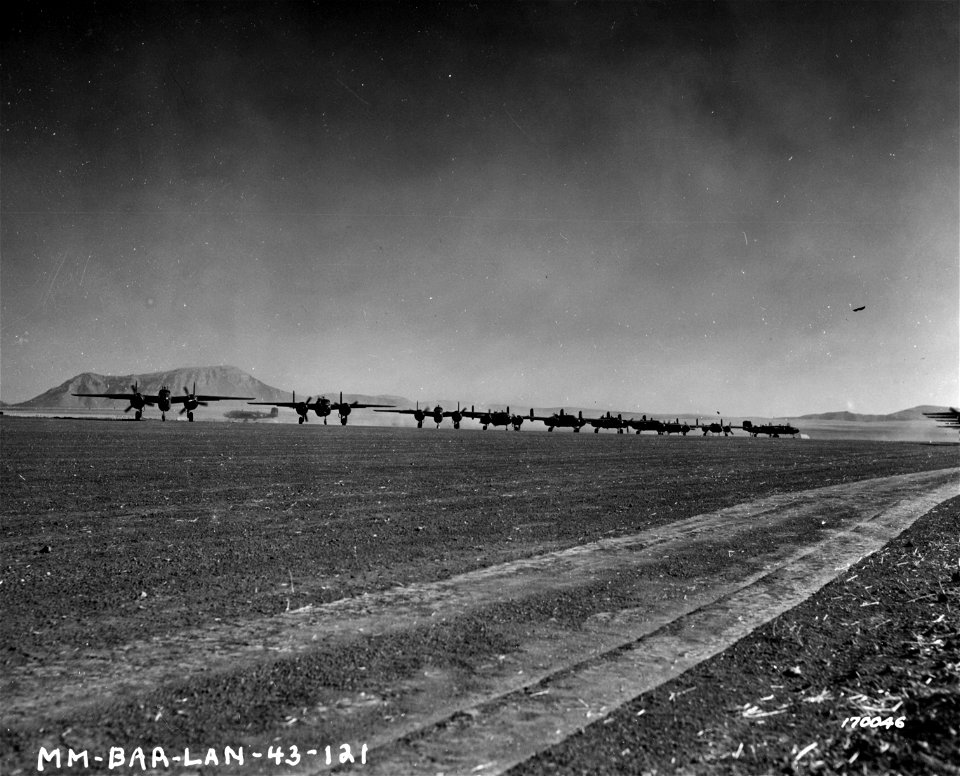 SC 170046 - B-25 bombers taking off for a raid. Berteux, North Africa. 12 February, 1943.