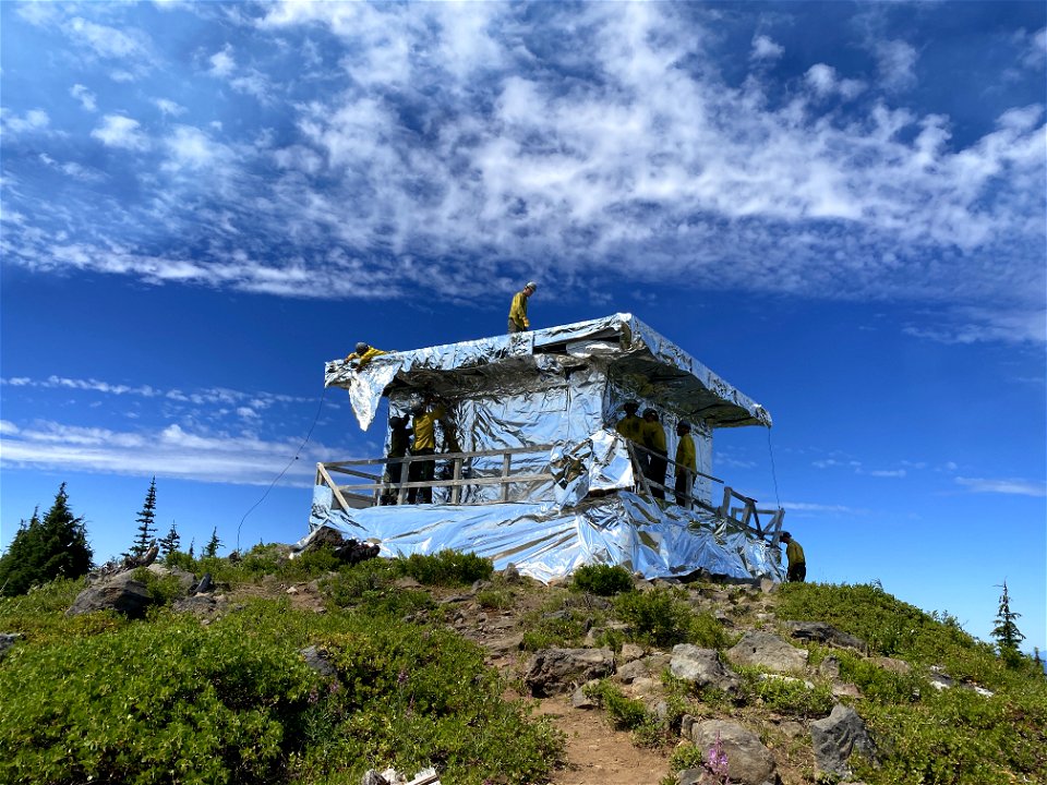 Waldo Mountain Lookout blanketed in aluminized wrap for protection against radiant heat and burning embers during the 2022 Cedar Creek Fire. August 5, 2022