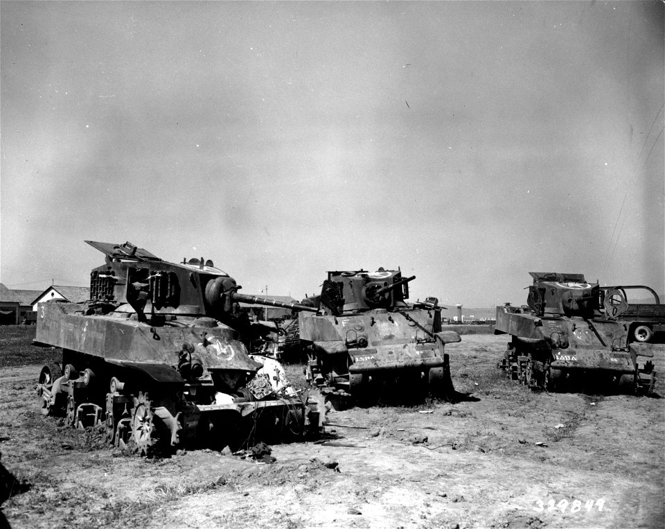 SC 329849 - The three destroyed tanks of the 881st Heavy Maintenance Co. are in the salvage yards in Grosseto, Italy. 1 September, 1944.