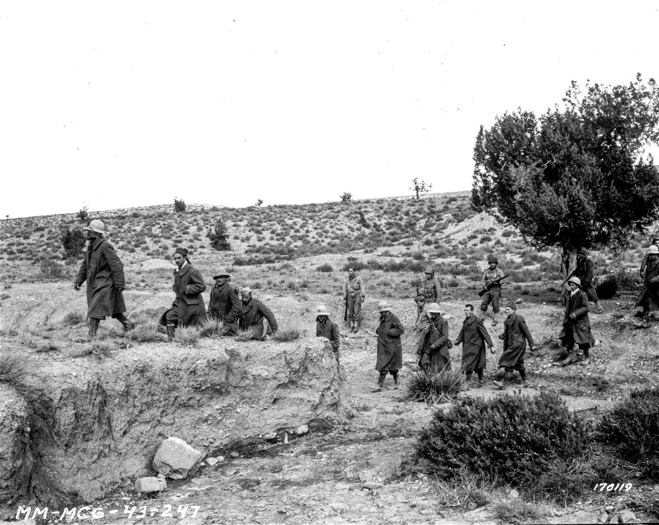 SC 170119 - Italian prisoners march from the stockade to truck.