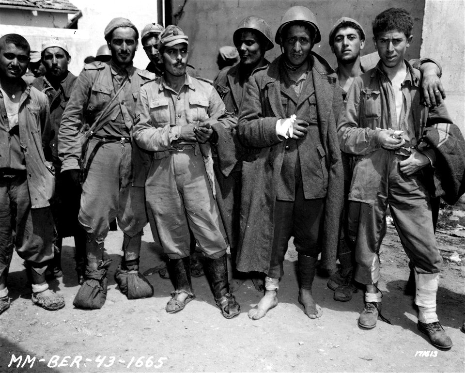 SC 171613 - Mussolini's Dream of Empire. Here are a few of his brave and hearty soldiers, without shoes and in rags, who walked miles to give themselves up to the Americans.