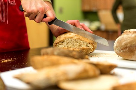 Slicing sourdough bread photo