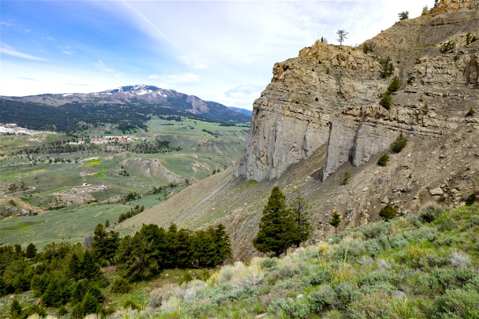 View of Mammoth Hot Springs and Sepulcher Mountain from Mt. Everts hillside (wide)