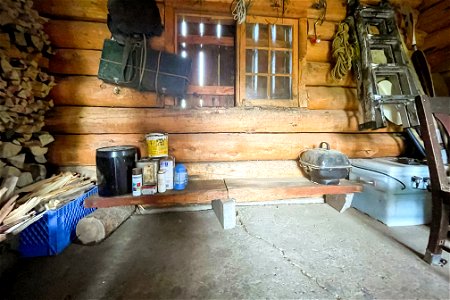 Heart Lake Patrol Cabin: inside barn north wall and foundation photo