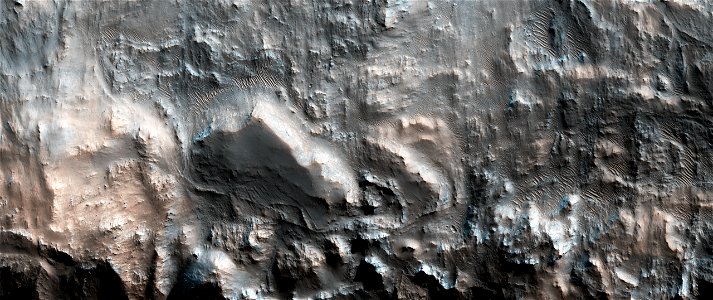 Diverse Exposures of Bedrock Associated with Massifs Outside Hellas Planitia