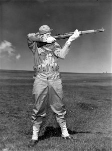 SC 364546 - Training picture to show correct rifle form while in standing position. Posed by T/5 Walter Barnett of Oklahoma City, Oklahoma. photo
