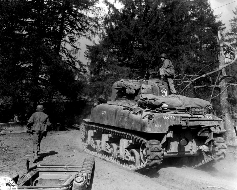 SC 337137 - Tanks take off for their firing positions. Mt. Valbura area, Italy. 14 April, 1945.