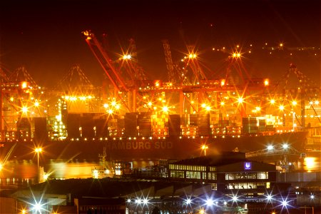 Ship in mooring at Durban Harbour. Night time. Is in "in" or "at" mooring? photo