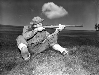 SC 364548 - Training picture to show correct rifle form while in sitting position. photo