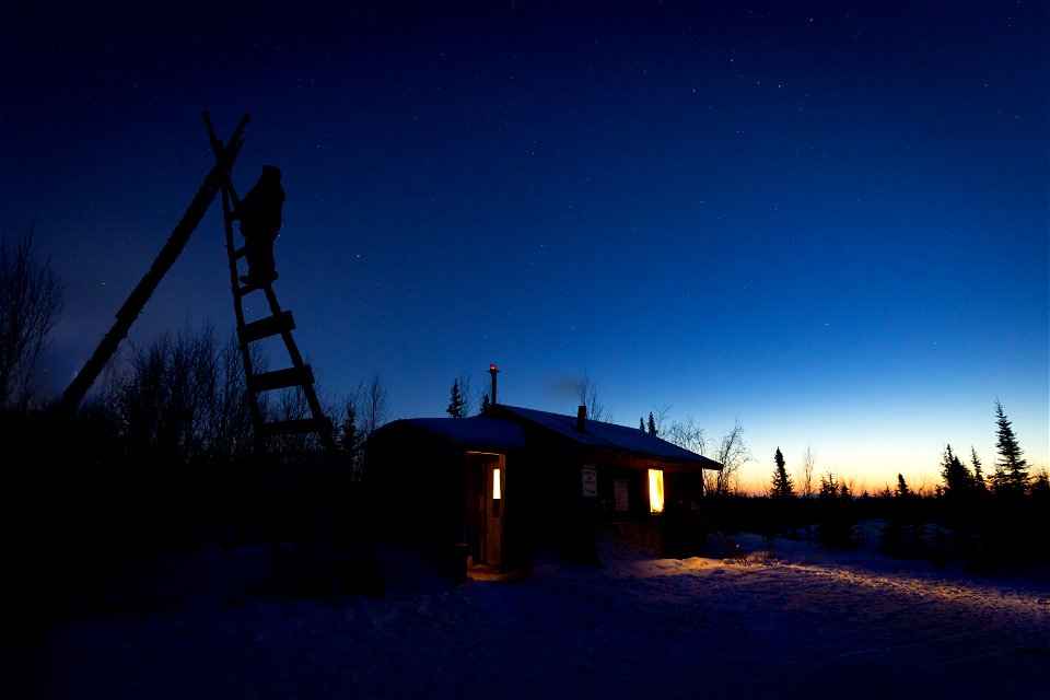 Watching for mushers from the Paniqsigvik shelter cabin at Selaw