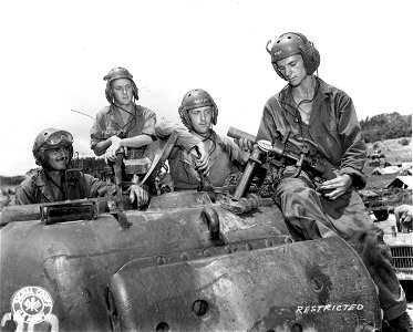 SC 335369 - Saipan. This tank crew used 2″ bomb throwers for protection to escape from enemy territory during the battle for the island.