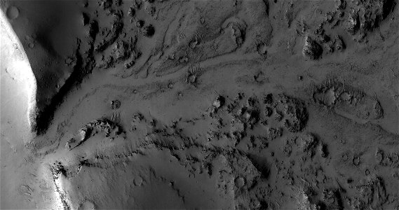 Breaching a Crater Rim in Tartarus Montes photo
