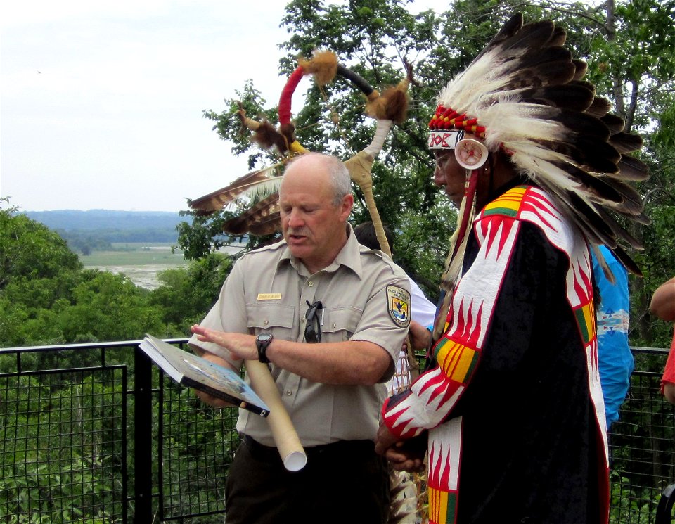 Minnesota Valley National Wildlife Refuge Manager Charlie Blair welcomes Chief Arvol Looking Horse to the Refuge and presents him with several gifts