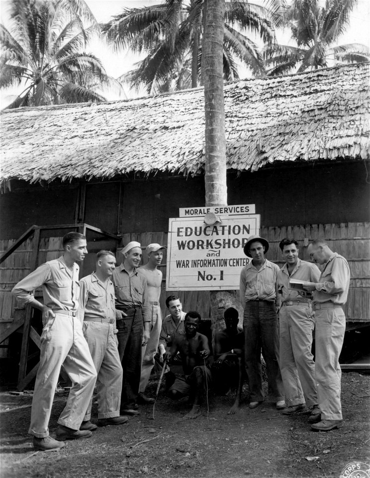 SC 335381 - Servicemen on Russell Islands getting information from Lt. John W. M. Rothney, of Wisc., about the Education Workshop and War Information Center set up on the island by the Morale Services.
