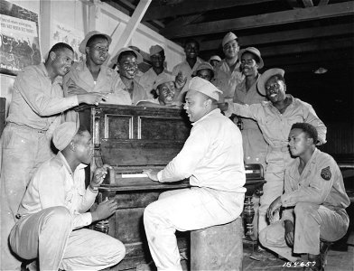 SC 184657 - Tropical Boogie-Woogie is given by Pvt. Albert Wright of Cleveland, Ohio, in a recreation hall in the South Pacific Area. photo