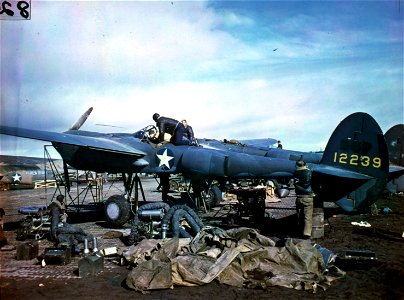 C-804 - Adak Island, Aleutians. View of repairs on P-38 in a revetment. 1944.
