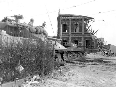 SC 334981 - Two U.S. tank destroyers are placed on street corners commanding main streets in the town of Krefeld, Germany. 3 March, 1945.