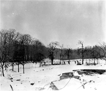 SC 336775 - Infantrymen of the 94th Division race for cover across the dragon's teeth of Siegfried Line near Tittingen, Germany. 19 January, 1945. photo
