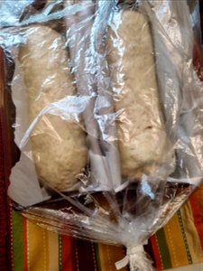 Sourdough bread loaves rising and plastic covered photo