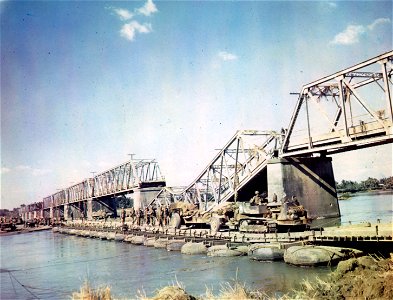 C-737 - Engineers of an Engineer Light Pontoon Company constructed this bridge beside the ruins of the Agnu River Bridge near Gerona, Luzon, P.I., on the drive to Manila.