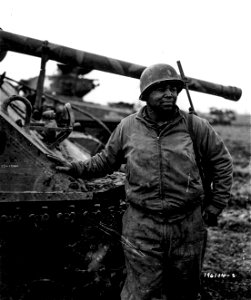 SC 196104-S - 2nd Lt. Joe E. Johnson, New York City, is a maintenance officer of a Motor Transport unit awaiting action, near Nancy, France. 5 November, 1944.