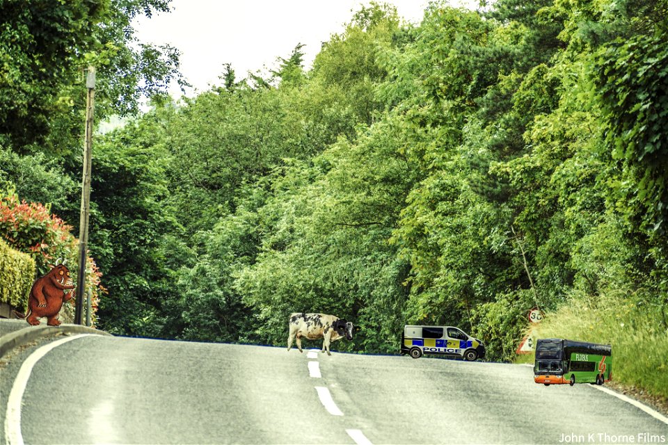 A blind summit is ahead in the road where at the top of a hill drivers may lose sight of the road as they go over the top of it.