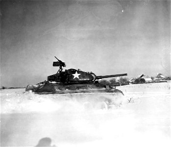 SC 198844 - The new M-24 tank, though using heavier armor, makes good speed through the snow somewhere on the Western Front. 14 January, 1945.