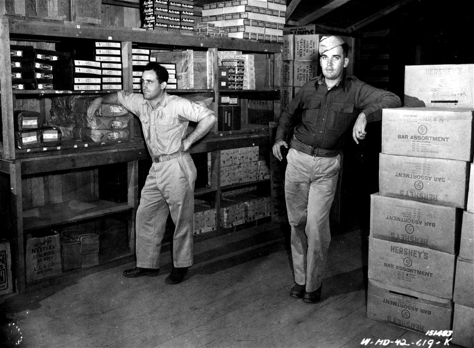 SC 151483 - Interior view of the warehouse building. In the photo are Pvt. Alex Friedman and 1st Lt. George Spark, Hawaii.