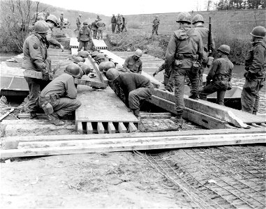 SC 335355 - It's only a little pontoon bridge, but Engrs. knew there was a war on when they labored for two days under all kinds of enemy fire to build it... photo