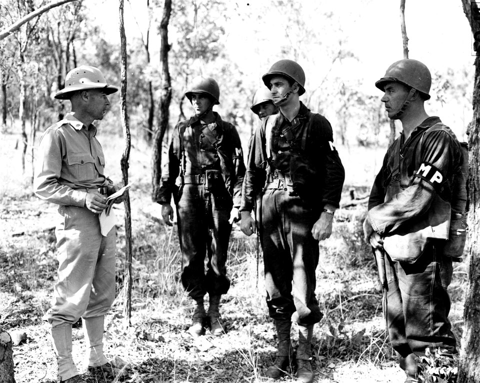 SC 166674 - Col. Edward A. Routheau, Provost Marshall, questioming men at a "prison camp" during a problem showing how the Military Police take care of enemy prisoners during war.