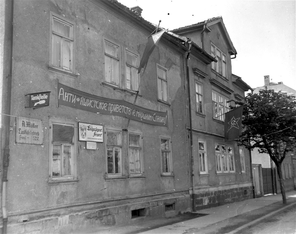 SC 334808 - A crimson banner, proudly announces the welcome to the Red Army as they enter Gotha, Germany.