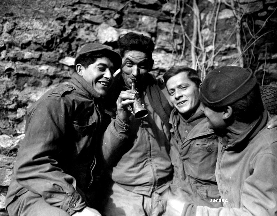 SC 335396 - Soldiers of the 24th Engineers, 4th Armored Division, practice Christmas carols during a rest period at Fenetrange, France.
