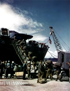 C-2360 - U.S. troops board a troop and freight ship at Le Havre, France, bound for the United States. July, 1945. photo