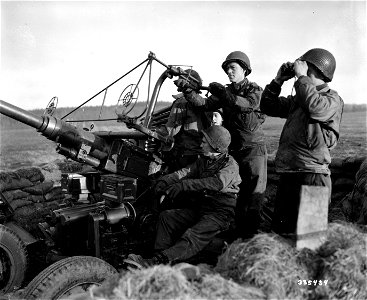 SC 335434 - The gun crew of a First Army anti-aircraft unit in Eupen, Belgium, has been alerted and is ready to fire when the enemy comes into sight.