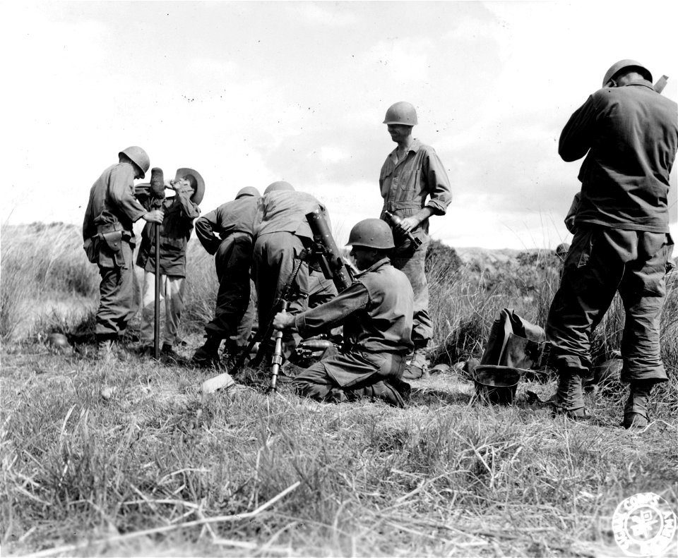 SC 364510 - Men of the Mortar Platoon, 126th Inf. Regt., 32nd Div., are shown firing the 81mm mortar on the Jap positions in in the Orboredo River sector, Luzon, P.I.