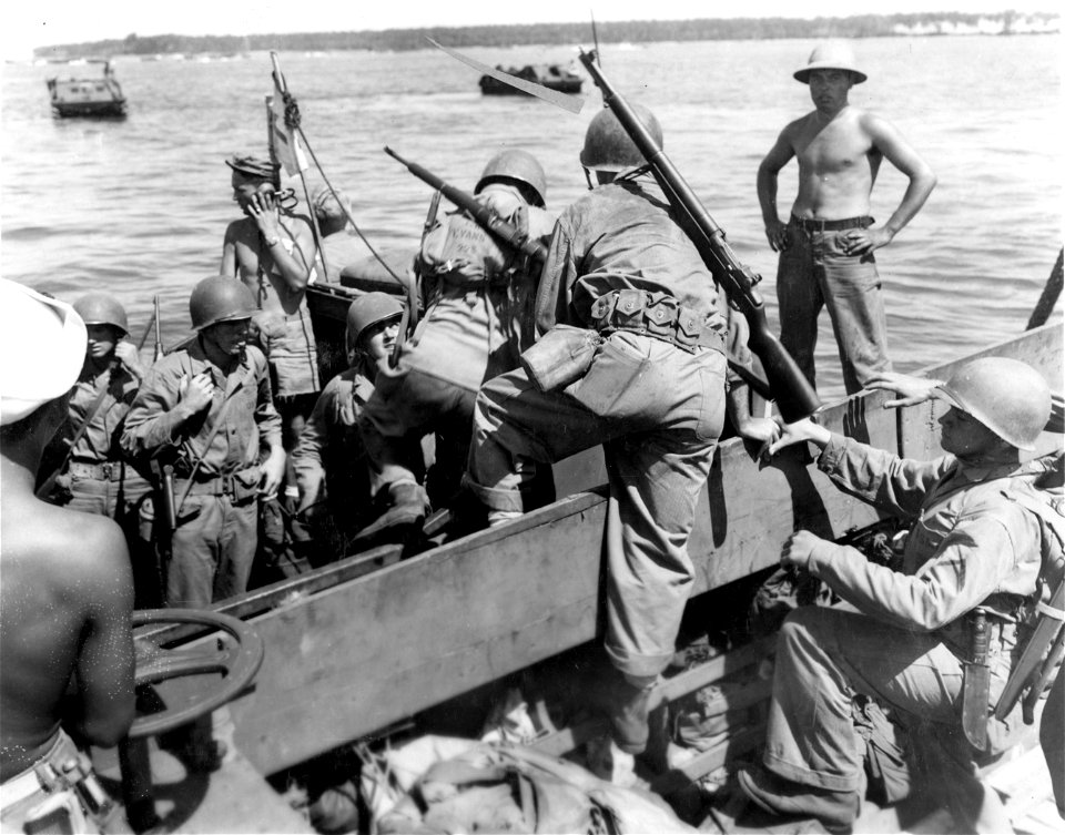 Transferring from Higgins Boats to amphibious tractors. Guadalcanal. 10 March, 1944.