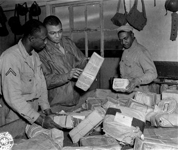SC 364373 - Personnel of the Postal Unit of a depot in England sort packages and mail.