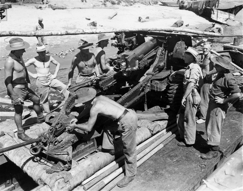 SC 364553 - Barge carrying an Australian 25 pounder mounted on coconut logs.