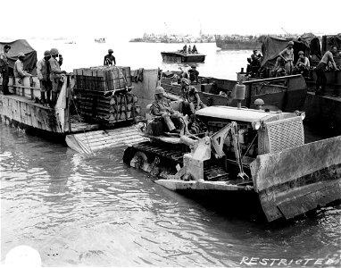 SC 374852 - Saipan. Port and Service Operations. Pulling ammo, pallets out of LCM.