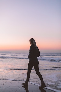 Female Walking on Beach photo