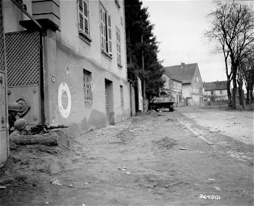 SC 364301 - An American road-block is set up with .30 caliber heavy machine gun, and a tank destroyer is ready for action on Adolph Hitler Strasse. photo